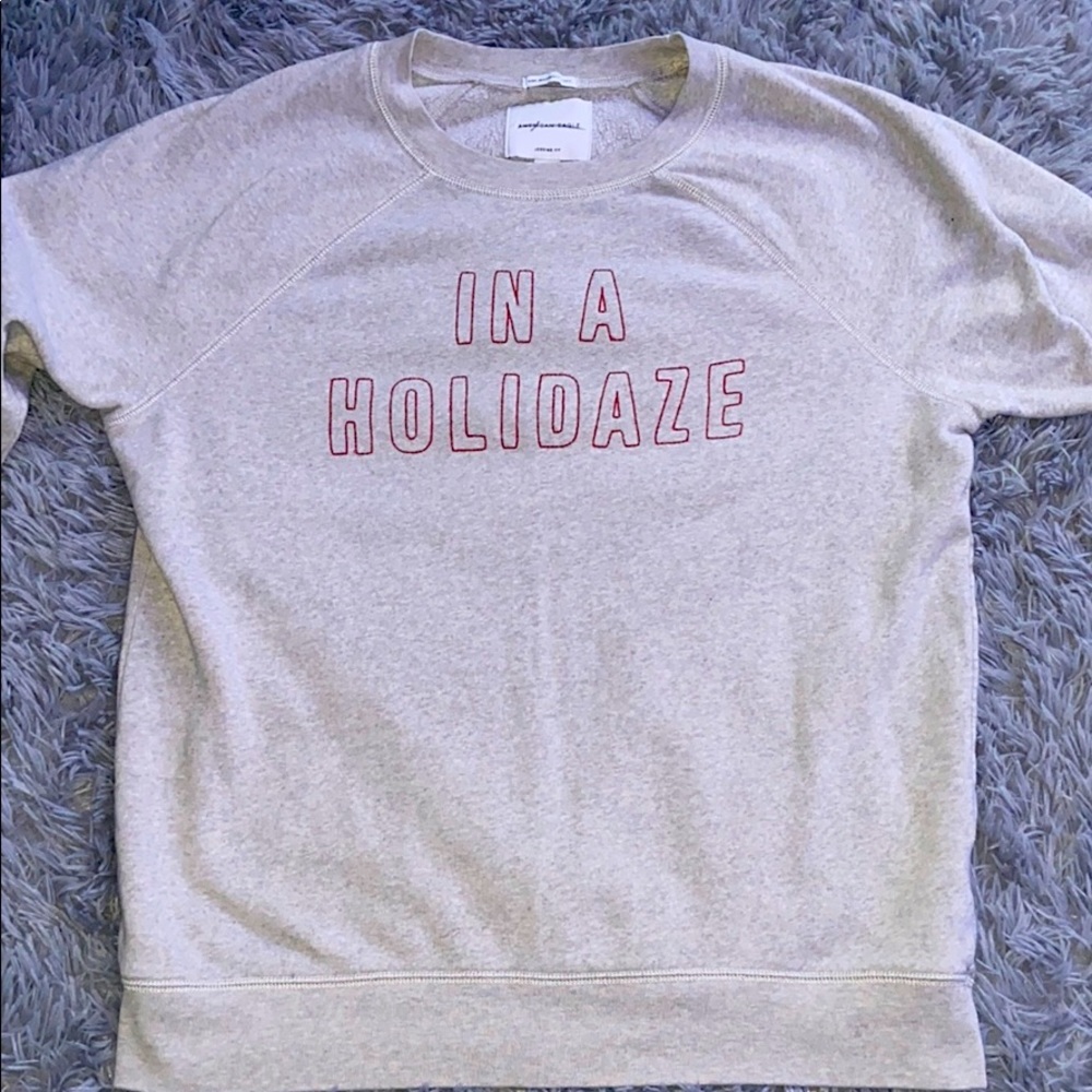 Gray crew neck that says “IN A HOLIDAZE”